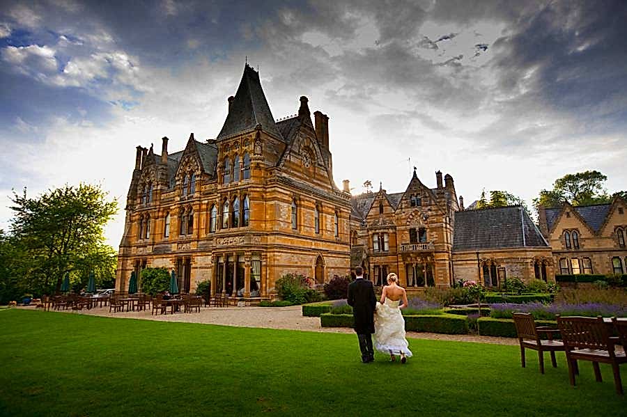 Ettington Park Ettington Park Backdrop of building with bride and groom