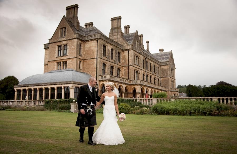 Walton Hall Walton Hall Bride and Groom walking in grounds